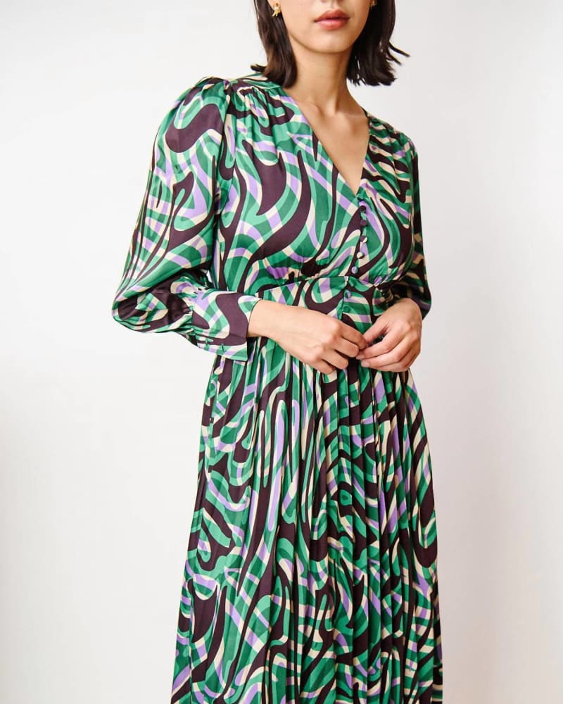 Front of a model wearing a size L Celya Midi Dress in Green/Purple Print in Green/Purple Print by Suncoo. | dia_product_style_image_id:338815
